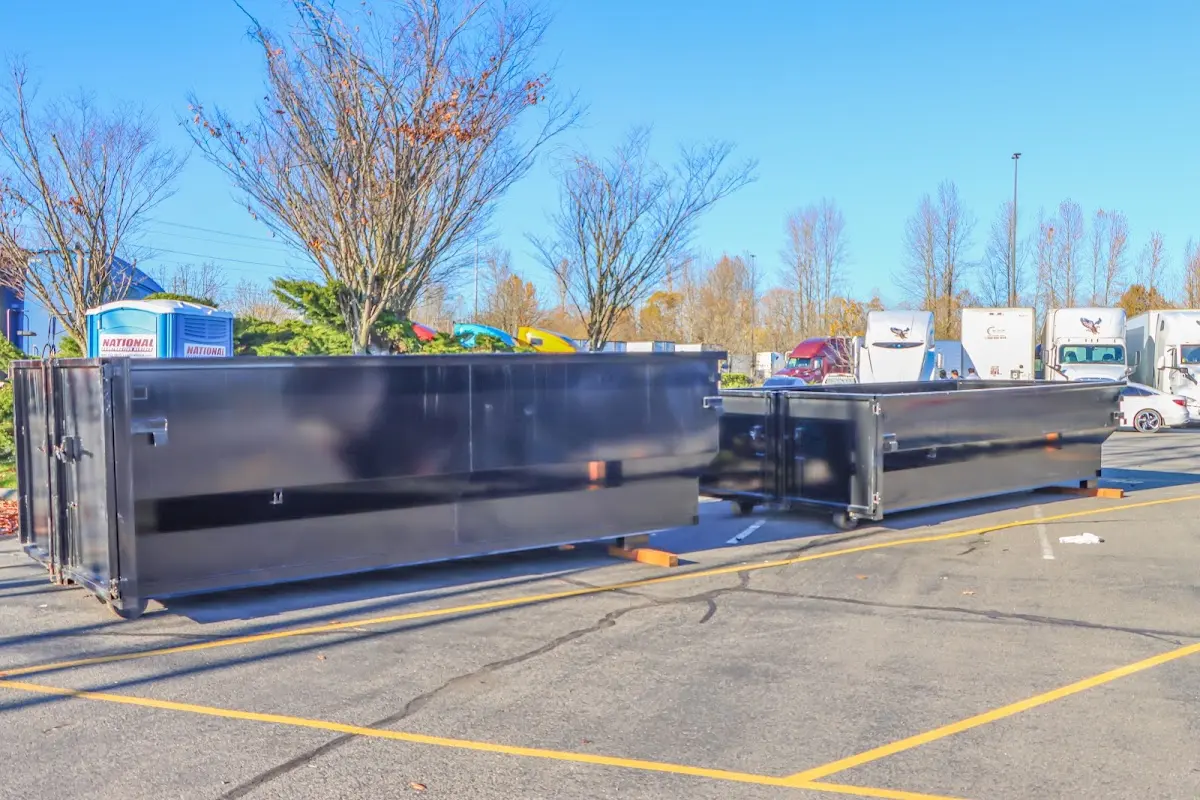 Professional dumpster rental service with roll-off container on residential driveway in Frankfort Square